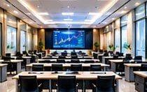 Training room with rows of desks and a presentation screen