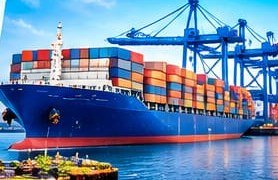 Container ship at a port with cranes